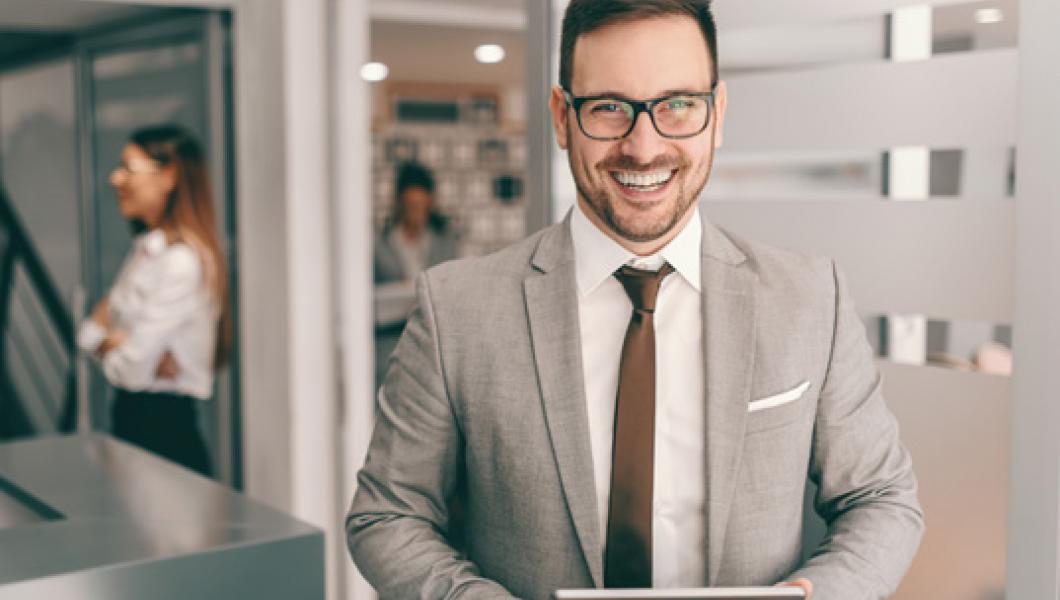 businessman in office holding tablet