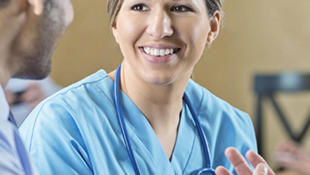 female nurse smiling at patient
