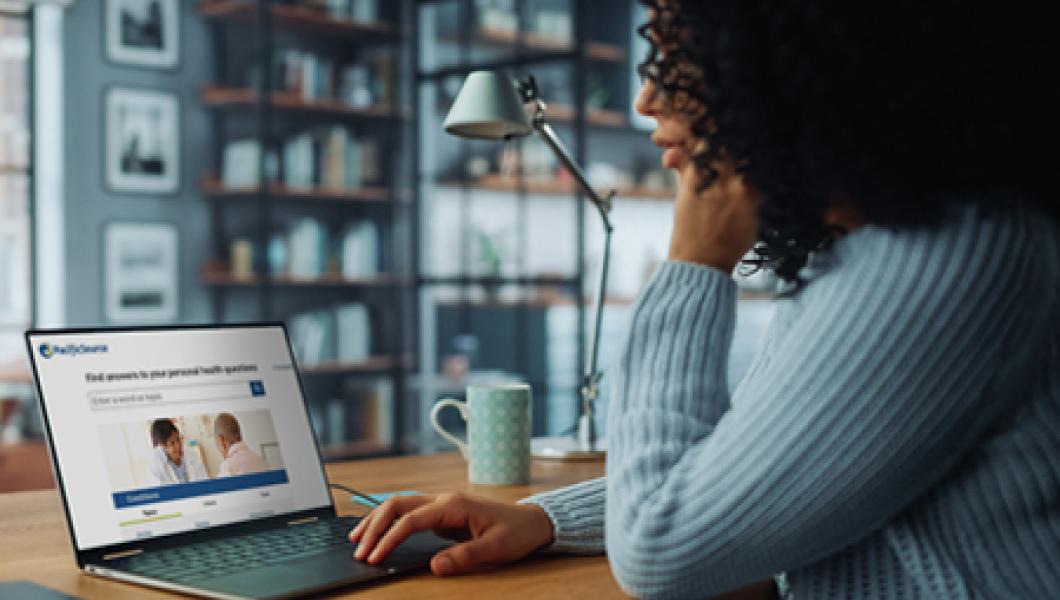 woman looking at healthwise on her laptop