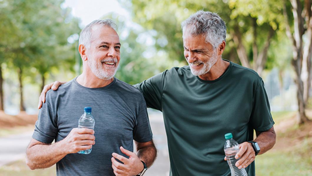 Two middle aged men walking