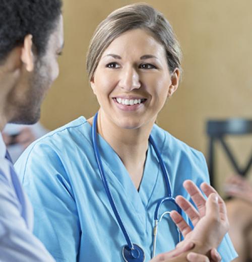 female nurse smiling at patient