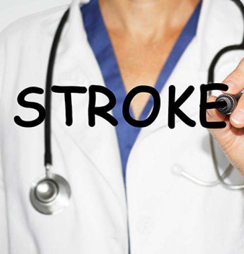 doctor writing the word stroke with marker