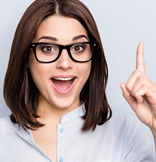 woman in glasses pointing her finger up