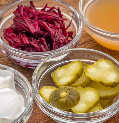 Small bowls of yogurt, pickles, and more