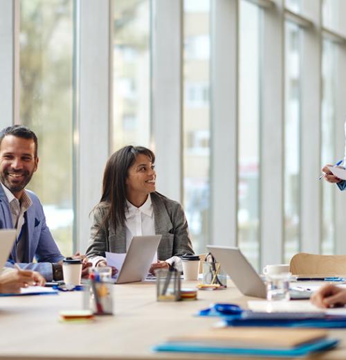 Group of colleagues meeting at conference table